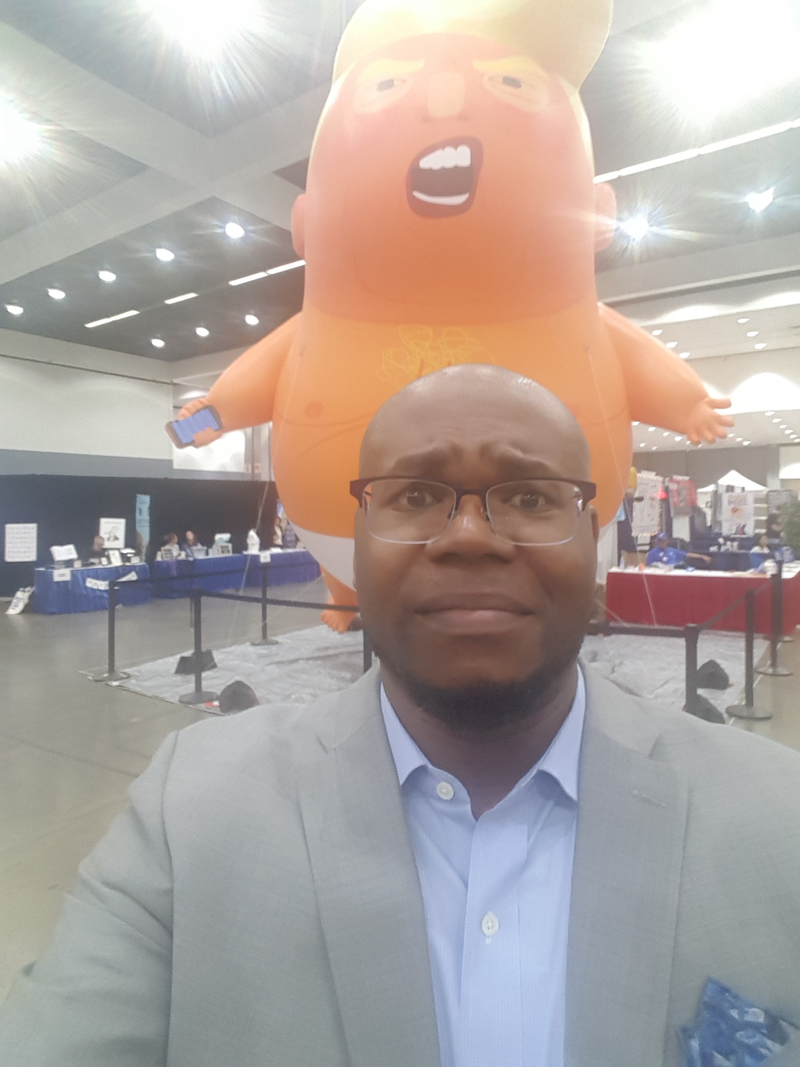Surrounded by Big Baby Trump at Politicon.